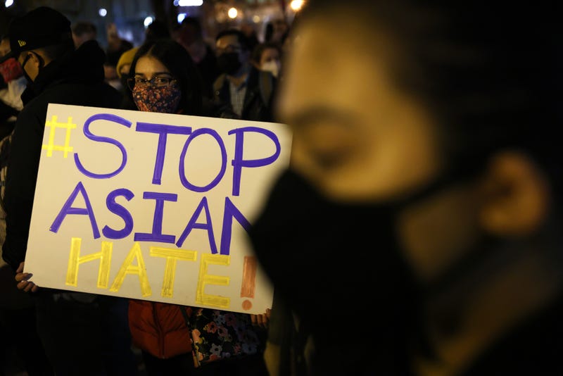Activists participate in a vigil in response to the Atlanta spa shootings March 17, 2021 in the Chinatown area of Washington, D.C.