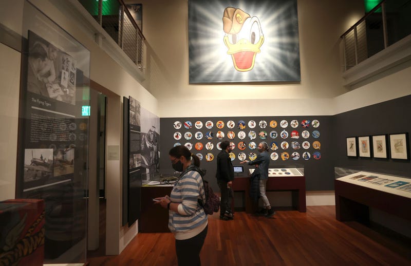 SAN FRANCISCO, CALIFORNIA - MARCH 18: Visitors view the Walt Disney and World War 2 exhibit at the Walt Disney Family Museum on March 18, 2021 in San Francisco, California. As San Francisco works through the red tier of reopening, the Walt Disney Family Museum is reopening to members before opening to the general public on March 19. The red tier allows museums to open indoor facilities at 25% capacity.
