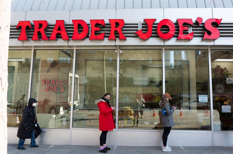 People stand in line outside Trader Joe's in Kips Bay amid the coronavirus pandemic on March 19, 2021 in New York City.