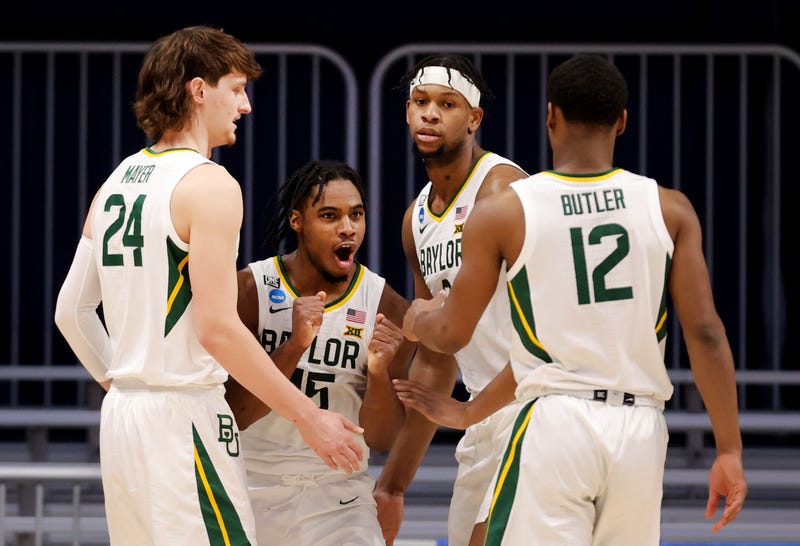 Baylor players celebrating during their second round March Madness game.