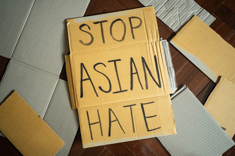 Stop Asian Hate written on cardboard.