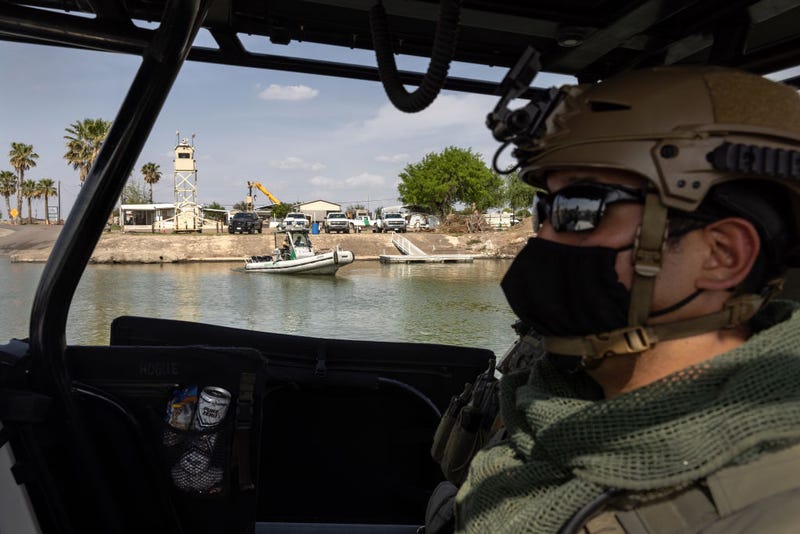 Members of the Texas Department of Public Safety's Tactical Marine Unit patrol the Rio Grande along while passing a U.S. Border Patrol boat on March 23, 2021 near Mission, Texas. Texas DPS troopers are taking part in Operation Lone Star in supporting U.S. Border Patrol agents to "deny Mexican Cartels and other smugglers the ability to move drugs and people into Texas." A surge of immigrants, including unaccompanied minors crossing into the United States from Mexico is overcrowding processing and detention centers in south Texas. (Photo by John Moore/Getty Images)