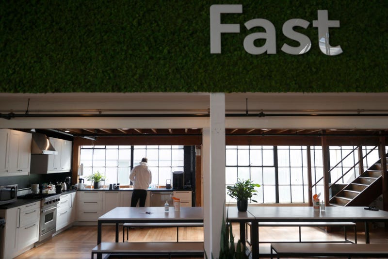  Vlad Lapich, with tech startup company Fast, makes coffee in the kitchen on the first day back in the office on March 24, 2021 in San Francisco, California.