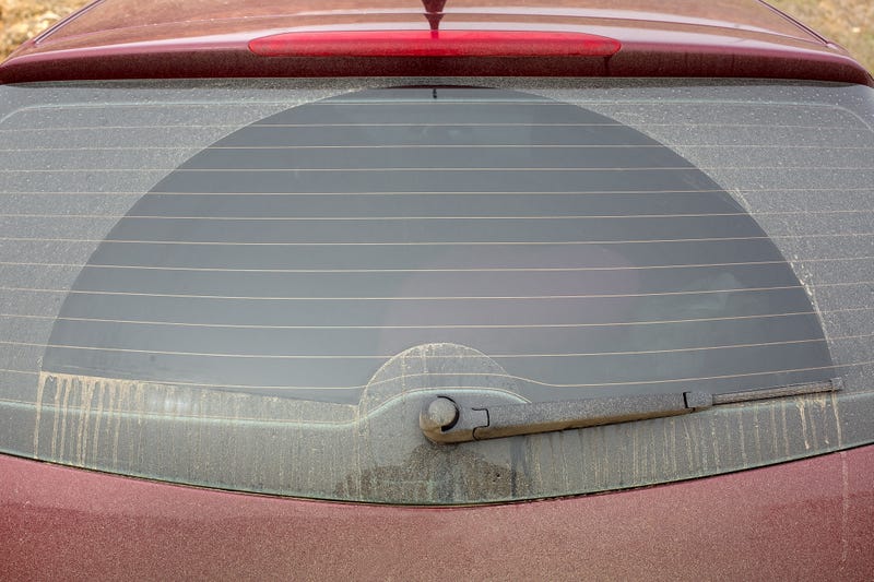 Dust on back window of car