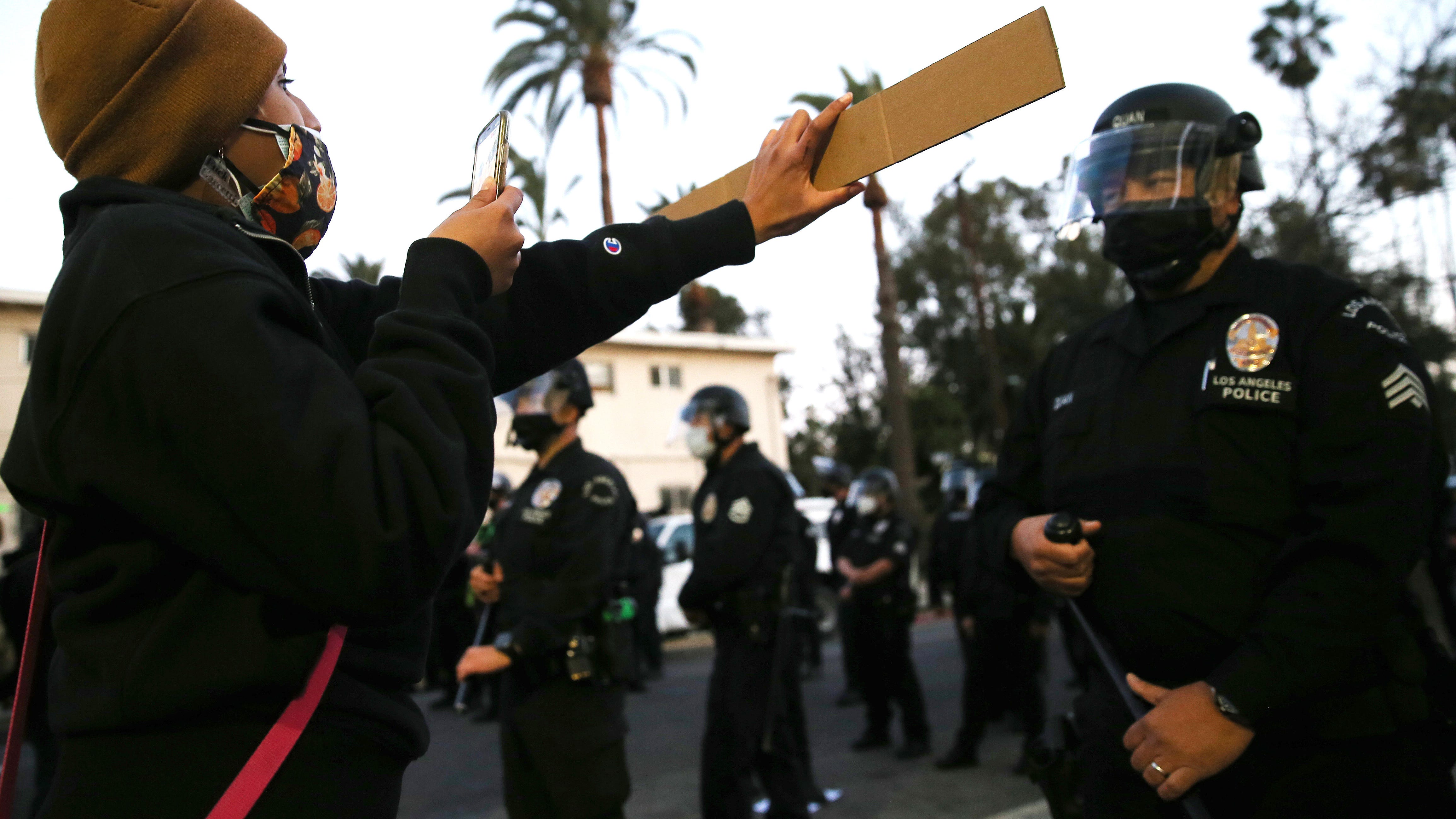 Online journalists sue L.A. Police for arrests during Echo Park Lake evictions