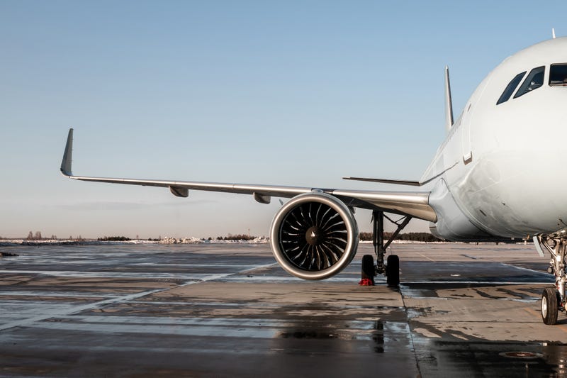 Airplane parked at its gate. 