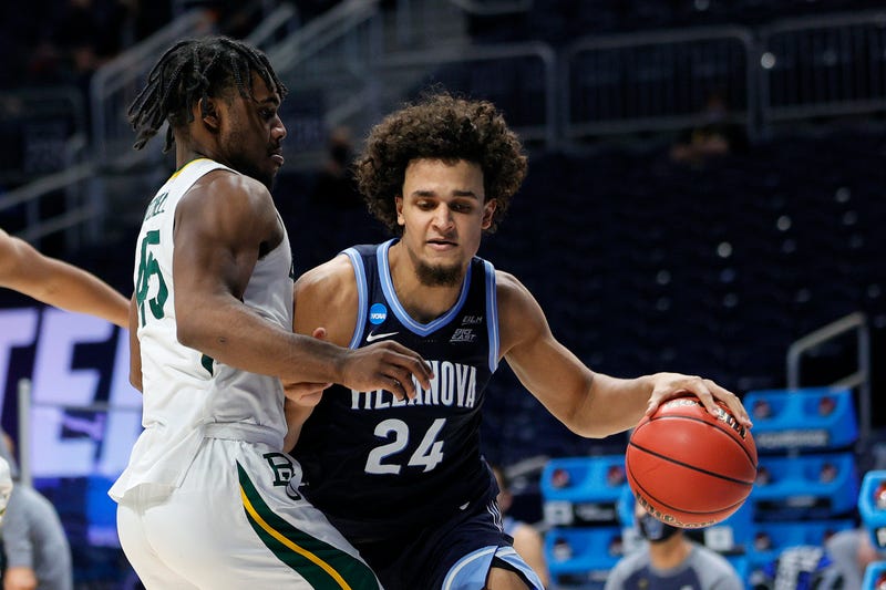 Villanova forward Jeremiah Robinson-Earl drives with the ball against Baylor's Davion Mitchell in the second half of their Sweet Sixteen game of the 2021 NCAA Men's Basketball Tournament at Hinkle Fieldhouse on March 27, 2021 in Indianapolis, Indiana.