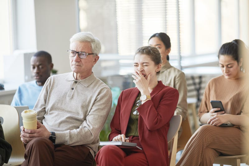 people looking bored in a meeting