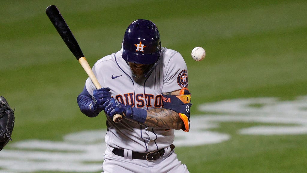 A's fans cheer after Carlos Correa gets hit by pitch, hold up trash can signs
