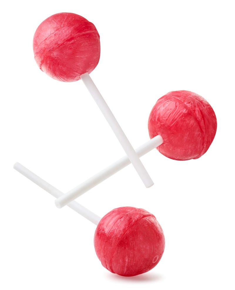 Red lollipops falling stock photo. 