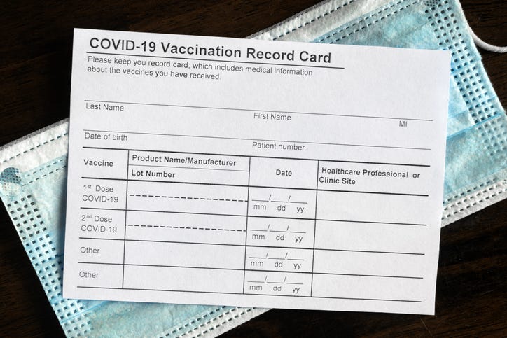 COVID-19 vaccine passport and mask. 