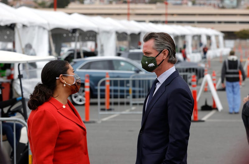California Gov. Gavin Newsom (R) talks with San Francisco Mayor London Breed after touring the vaccination clinic at City College of San Francisco on April 06, 2021 in San Francisco, California