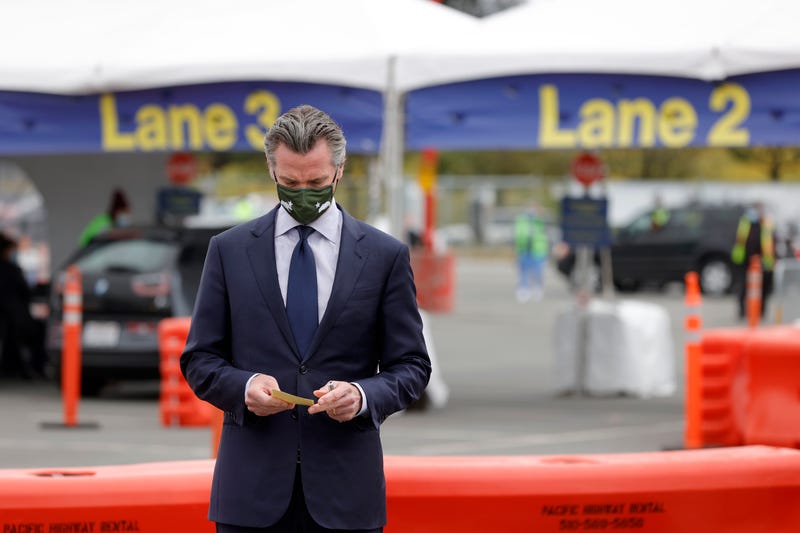 California Gov. Gavin Newsom looks at his notes before speaking at a news conference at the vaccination clinic at City College of San Francisco on April 06, 2021 in San Francisco, California.