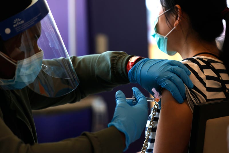 A nurse administers a COVID-19 vaccination during a vaccination clinic for Special Olympics athletes, coaches and family members at Levi's Stadium on April 08, 2021 in Santa Clara, California