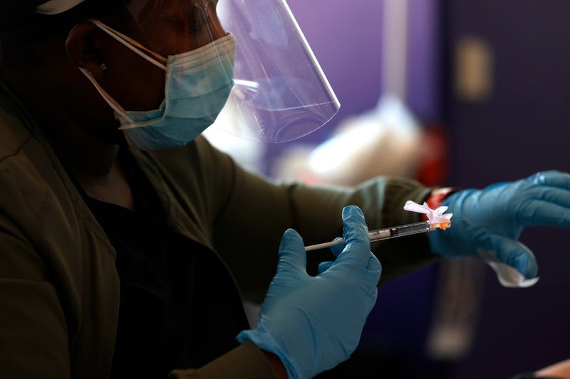 A nurse administers a COVID-19 vaccination during a vaccination clinic for Special Olympics athletes, coaches and family members at Levi's Stadium on April 08, 2021 in Santa Clara, California.