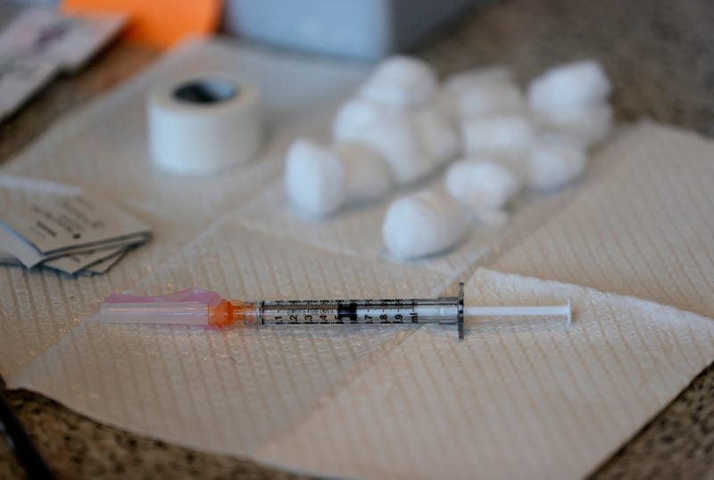 A syringe with a dose of COVID-19 vaccine sits on a table during a vaccination clinic for Special Olympics athletes, coaches and family members at Levi's Stadium on April 08, 2021 in Santa Clara, California.