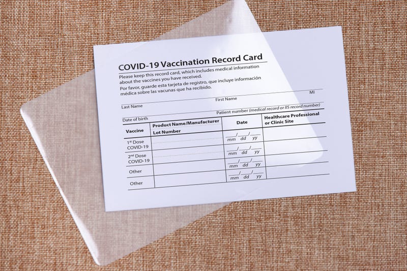 Coronavirus vaccination card and laminate foil. Concept of safe traveling and overcoming of coronavirus. High quality photo