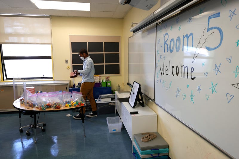 Bryant Elementary School kindergarten teacher Chris Johnson sets up his classroom on April 09, 2021 in San Francisco, California. 