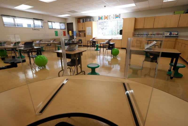 Plexiglass dividers are set up on tables in a first grade classroom at Bryant Elementary School on April 09, 2021 in San Francisco, California.