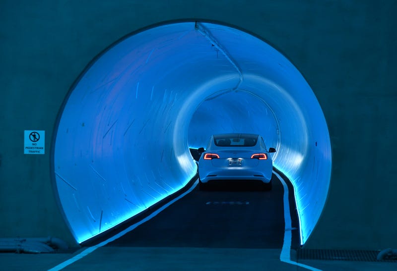  Tesla car drives through a tunnel in the Central Station during a media preview of the Las Vegas Convention Center Loop
