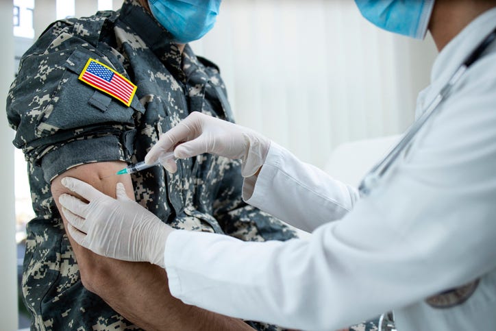 Military member getting a vaccination. 
