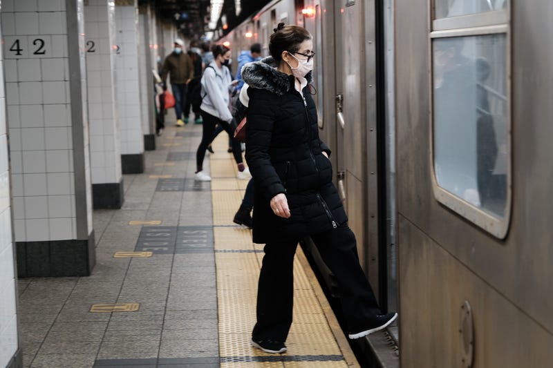 People move through a New York City subway station on April 13, 2021 in New York City
