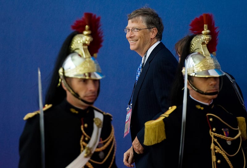 bill gates standing by soldiers