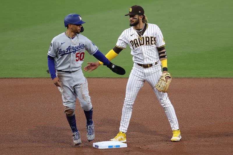 Dodgers outfielder Mookie Betts and Padres shortstop Fernando Tatis Jr. acknowledge each other at second base.