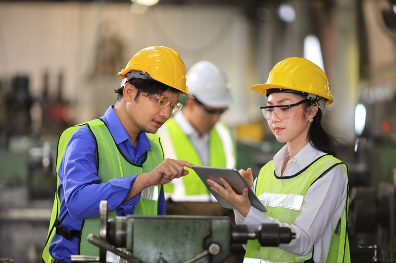 Team of engineers in full safety equipment 
