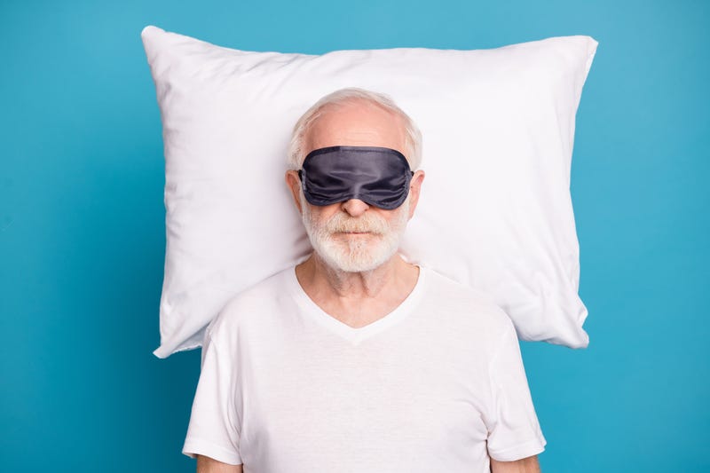 Older man sleeping stock photo. 