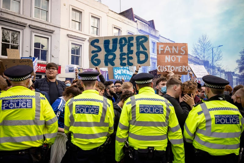 Fans of Chelsea Football Club protest against the European Super League outside Stamford Bridge on April 20, 2021 in London, England. Six English premier league teams have announced they are part of plans for a breakaway European Super League. Arsenal, Manchester United, Manchester City, Liverpool, Chelsea and Tottenham Hotspur will join 12 other European teams in a closed league similar to that of the NFL American Football League. In a statement released last night, the new competition "is intended to commence as soon as practicable" potentially in August. 
