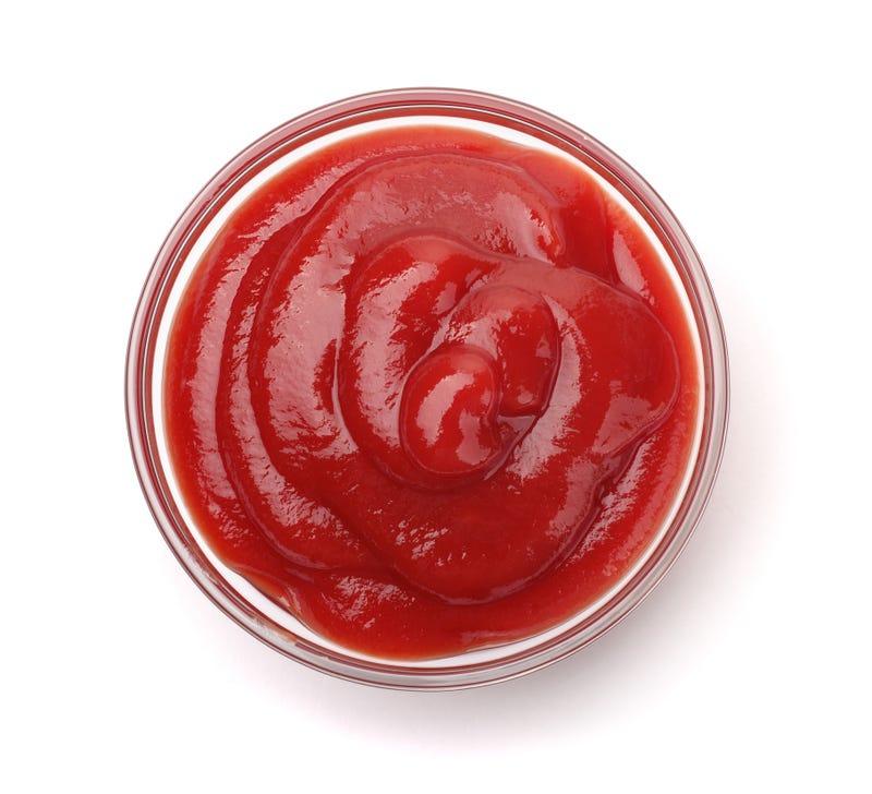 Ketchup in a bowl stock photo. 