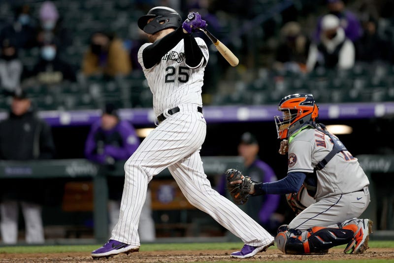 C.J. Cron #18 of the Colorado Rockies hits a two RBI double against the Houston Astros in the sixth inning at Coors Field on April 20, 2021 in Denver, Colorado. 