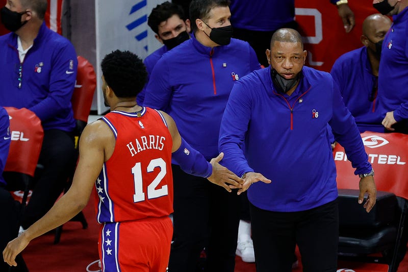 PHILADELPHIA, PENNSYLVANIA - APRIL 26: Head coach Doc Rivers of the Philadelphia 76ers at Wells Fargo Center fives Tobias Harris #12 during the third quarter on April 26, 2021 in Philadelphia, Pennsylvania.
