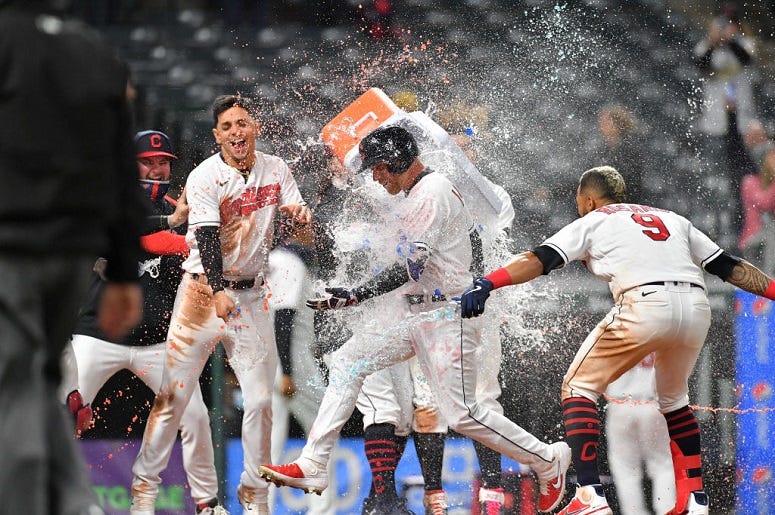 Jordan Luplow #8 of the Cleveland Indians celebrates with his teammates after hitting a walk-off two run home run