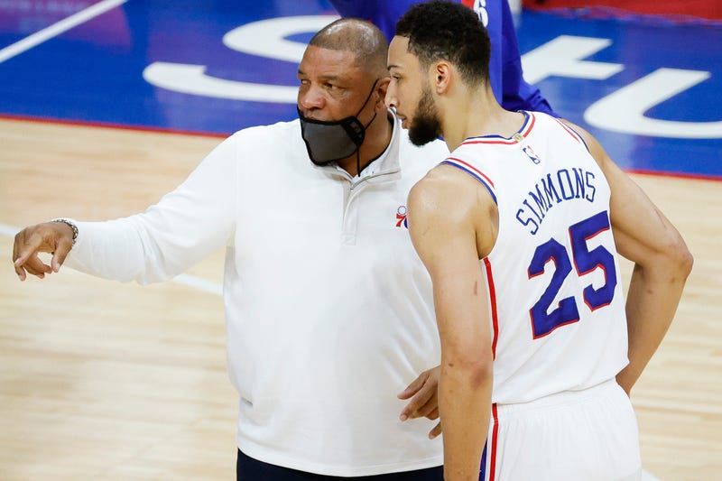 PHILADELPHIA, PENNSYLVANIA - APRIL 28: Head coach Doc Rivers of the Philadelphia 76ers speaks with Ben Simmons #25 during the first quarter against the Atlanta Hawks at Wells Fargo Center on April 28, 2021 in Philadelphia, Pennsylvania.