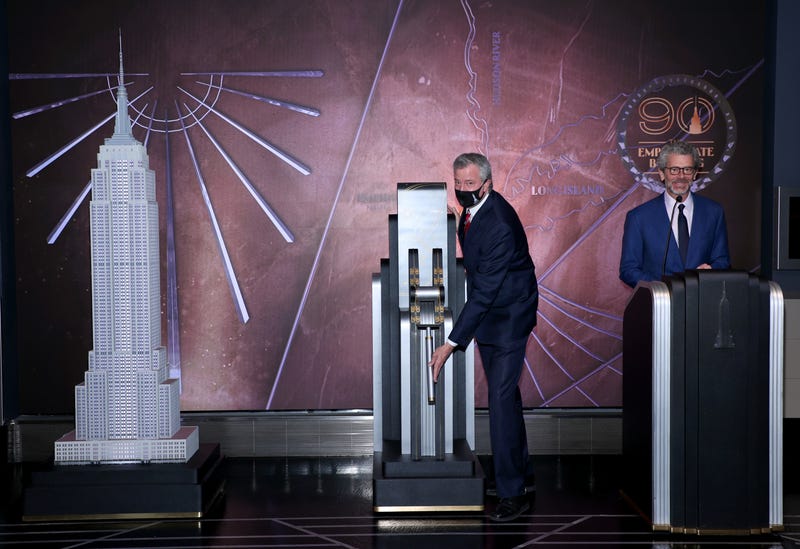 New York City Mayor Bill De Blasio and President and CEO of Empire State Realty Trust, Tony Malkin speaks at special 90th anniversary lighting at The Empire State Building on May 01, 2021 in New York City