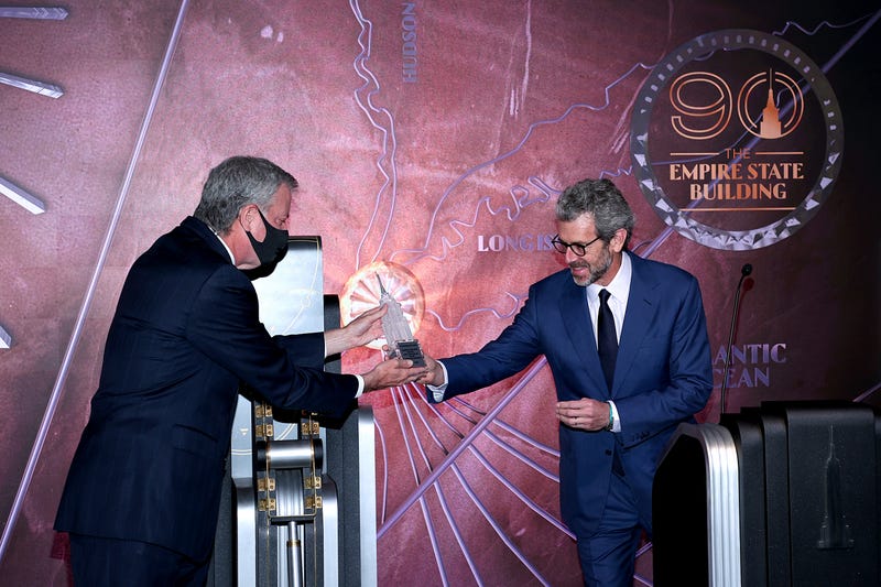 New York City Mayor Bill De Blasio and President and CEO of Empire State Realty Trust, Tony Malkin speaks at special 90th anniversary lighting at The Empire State Building on May 01, 2021 in New York City