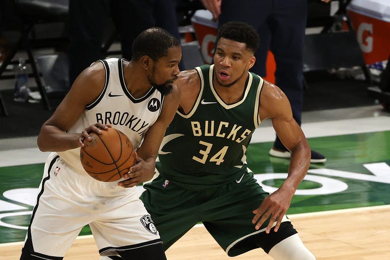 Bucks star Giannis Antetokounmpo guards Nets star Kevin Durant. 