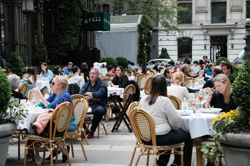 People dine outside at a restaurant at Bryant Park in Manhattan on May 04, 2021 in New York City