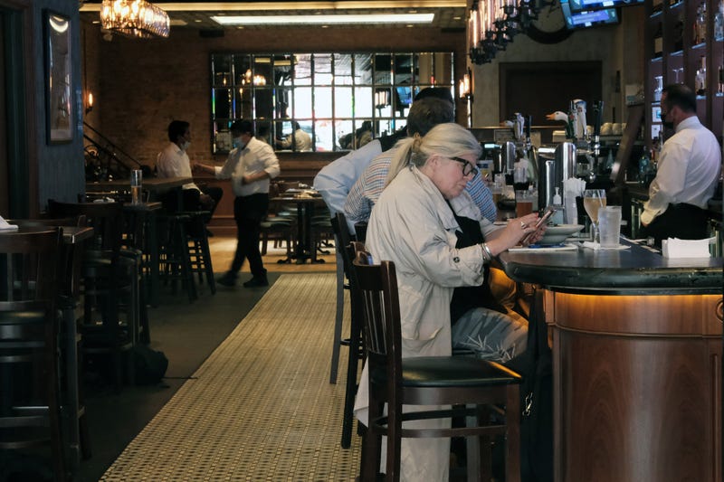 diners seated at a bar