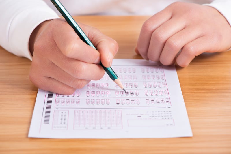 File photo of a student taking a test with a scantron