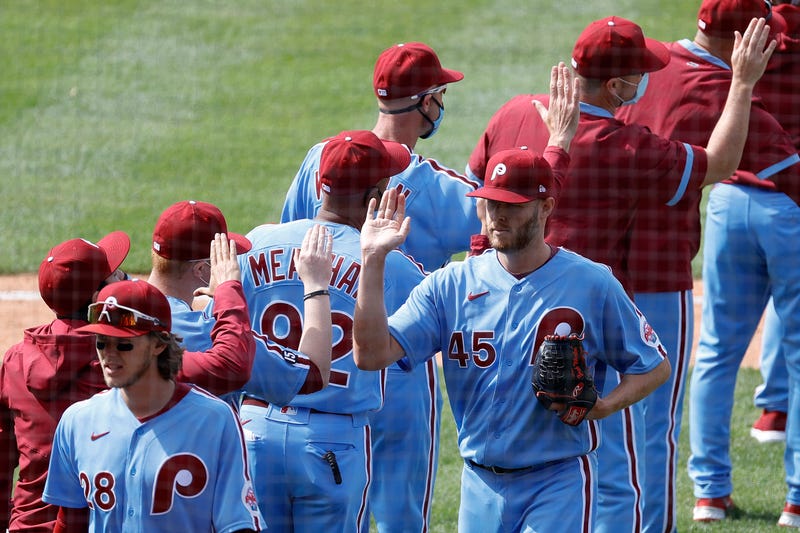 Zack Wheeler #45 of the Philadelphia Phillies (R) celebrates with teammates after defeating the Milwaukee Brewers at Citizens Bank Park on May 06, 2021 in Philadelphia, Pennsylvania.