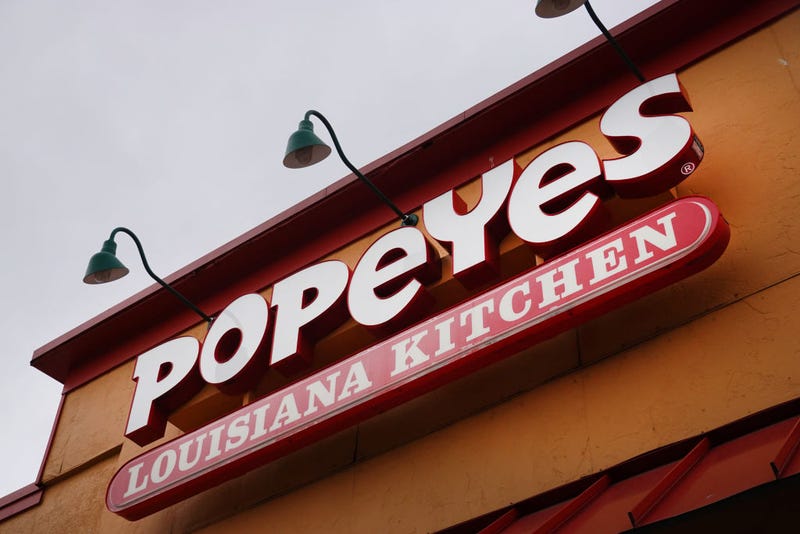 A sign hangs outside of a Popeyes Louisiana Kitchen restaurant on May 06, 2021