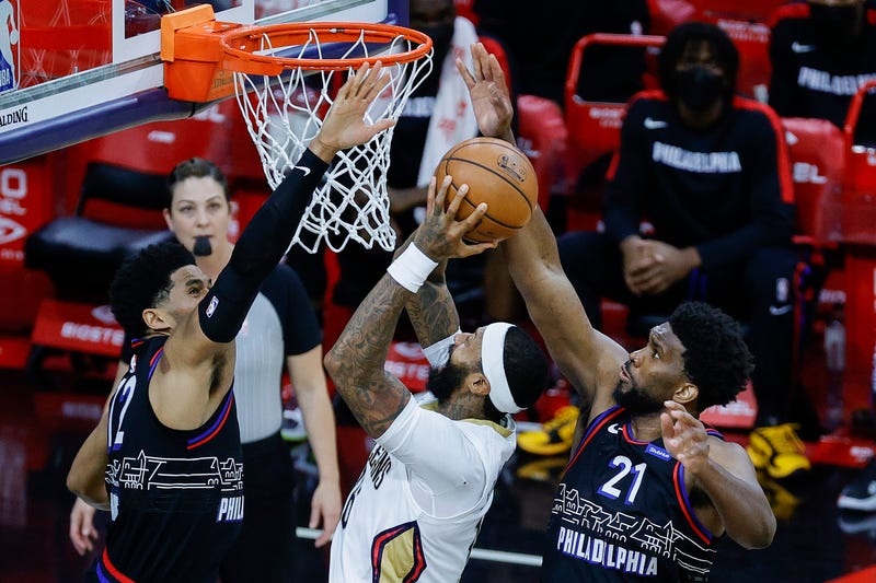Joel Embiid and Tobias Harris of the Philadelphia 76ers defend the shot attempt by James Johnson of the New Orleans Pelicans during the fourth quarter at Wells Fargo Center on May 07, 2021 in Philadelphia, Pennsylvania.
