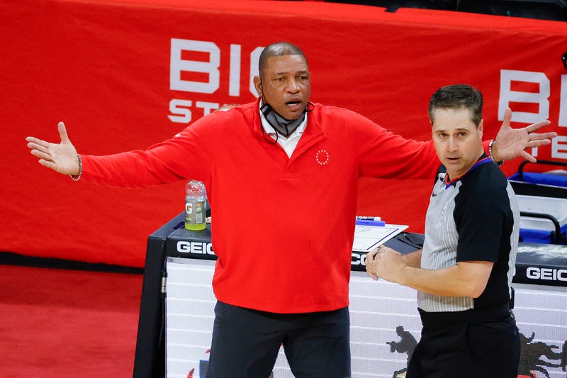 PHILADELPHIA, PENNSYLVANIA - MAY 14: Head coach Doc Rivers of the Philadelphia 76ers speaks with referee David Guthrie #16 during the first quarter at Wells Fargo Center on May 14, 2021 in Philadelphia, Pennsylvania.