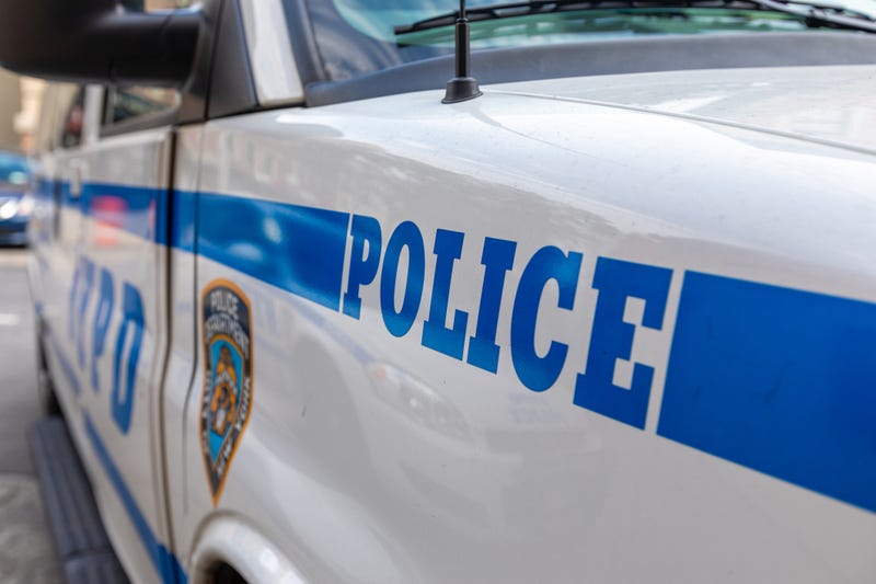 Police discovered a man's body in Queens Friday afternoon with a stab wound to the neck.