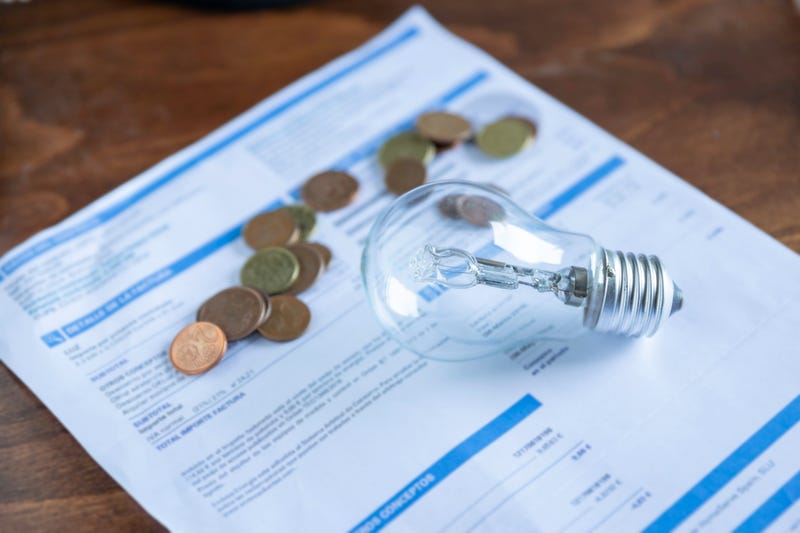 Light bill with light bulb. Conceptual about the price of electricity and paying taxes