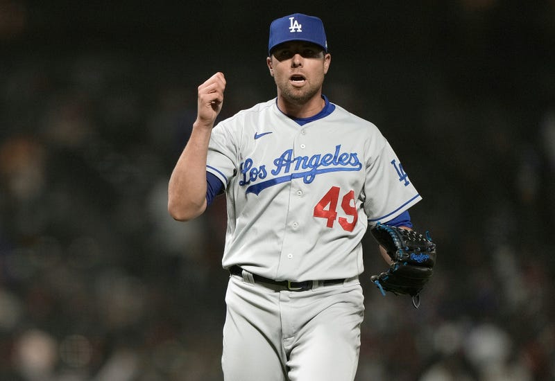Blake Treinen #49 of the Los Angeles Dodgers reacts after getting the final out of the game against the San Francisco Giants in the ninth inning at Oracle Park on May 21, 2021 in San Francisco, California.