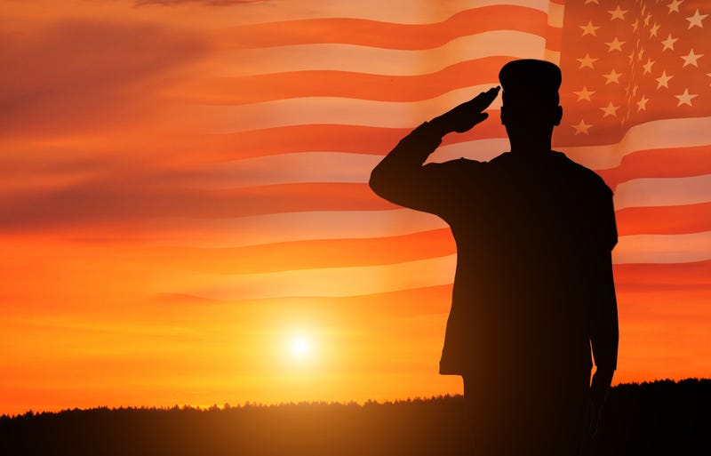 Silhouette of soldier on American Flag